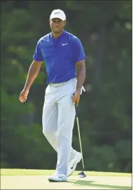  ?? Stuart Franklin / Getty Images ?? Tiger Woods reacts on the 17th green during the third round of the PGA Championsh­ip at Bellerive Country Club on Saturday in St Louis.