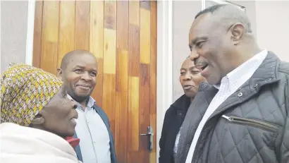  ?? Picture: Supplied ?? JOY. Emfuleni local municipali­ty executive mayor Mahole Simon Mofokeng, right, welcomes Selina Mahlasela into her new house.