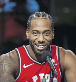  ?? ERNEST DOROSZUK ?? Kawhi Leonard speaks during Raptors Media Day in Toronto on Monday. He kept his thoughts on his past in San Antonio and pending free agency close to his vest, noting his focus is on this season.