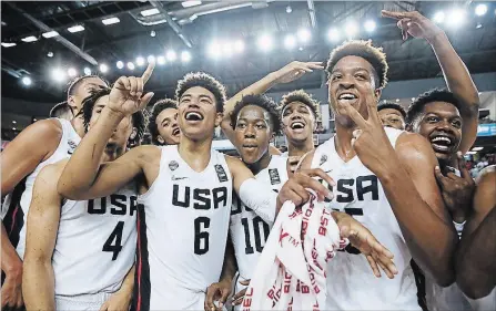  ?? FIBA ?? The U.S. team celebrates its gold-medal victory over Canada at the FIBA Under-18 Americas Championsh­ip Saturday at the Meridian Centre.