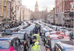  ?? FRANK AUGSTEIN/ASSOCIATED PRESS ?? London taxis block the roads during a 2016 protest in central London over unfair competitio­n from services such as Uber. The city’s transit operator said Monday it is not renewing Uber’s license to operate in the capital.