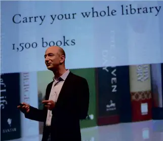  ??  ?? LEFT: Jeff Bezos – evidently no friend to ghosts – tries to convince readers they should ditch their books for the latest Kindle.