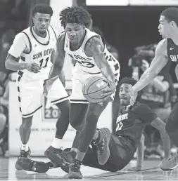  ?? ROB SCHUMACHER/THE REPUBLIC ?? Arizona State forward Romello White takes control of a loose ball during Tuesday’s game against San Diego State. White finished with a double-double in his ASU debut.