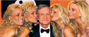  ?? LAURENT REBOURS/ASSOCIATED PRESS FILE PHOTO ?? Playboy founder Hugh Hefner gathers with Playboy playmates in 1999 during the Cannes Film Festival in Cannes, France. Hefner has died at age 91.