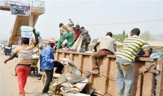  ?? PHOTO: IKECHUKWU IBE ?? Searching for valuables at a refuse dump in Nyanya, Abuja yesterday.