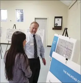  ?? PHOTO JULIO MORALES ?? Clyde Prem, senior transporta­tion planner for KOA Corp., speaks with Calipatria resident Kaitlyn Zendejas on Oct. 15 during a community meeting to discuss the city’s proposed bicycle master plan.