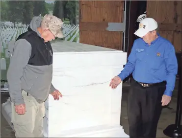  ?? File, Doug Walker / RN-T ?? Buddy Simpson (left) and Bill King check out the detail on the 50 percent replica of the Tomb of the Unknown Soldier, part of an exhibit to honor America’s fallen war heroes at the Community Building at the Coosa Valley Fairground­s.