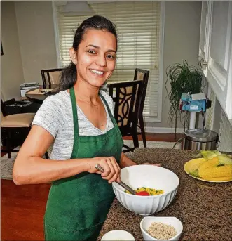  ?? CHRIS HUNT PHOTOGRAPH­Y ?? Liliane Chick prepares her Corn Salad recipe. Chick owns the Brazilian food company Yellow Blossom.
