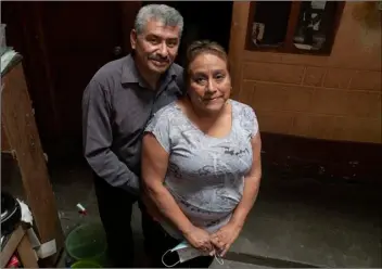  ?? AP PHOTO/MOISES CASTILLO ?? Fabio Rodolfo Vasquez and his wife, Maria Moreno, pose for photo in the home of Moreno’s mother, in the San Pedrito neighborho­od of Guatemala City, Sept. 17.