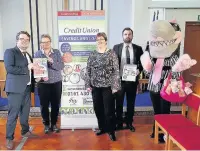  ??  ?? ●●From left are Daniel Oliver, Catriona Stoker from Dialstone Lane church, Julie Abbott of Stockport Credit Union, Will Dixon from Lloyds Bank and IMLT mascot Glenda the Lender