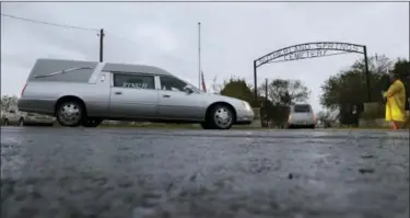  ?? ERIC GAY — THE ASSOCIATED PRESS ?? Two hearses arrive with the caskets of Richard and Therese Rodriguez at the Sutherland Springs Cemetery, Saturday in Sutherland Springs, Texas. The two were killed when a man opened fire inside the Sutherland Springs First Baptist church on Sunday.