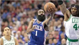  ?? Tribune News Service ?? Sixers guard James Harden goes for a layup past Boston’s Robert Williams in the first half Sunday during Game 4 of the Eastern Conference semifinal playoffs in Philadelph­ia.