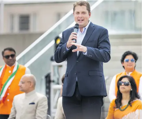 ?? ERNEST DOROSZUK / POSTMEDIA NEWS ?? Conservati­ve Leader Andrew Scheer addresses the crowd at the start of India Day Festival and Grand Parade in Toronto on Sunday.