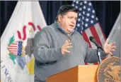  ?? CHRIS SWEDA/CHICAGO TRIBUNE ?? Gov. J.B. Pritzker gives a coronaviru­s update Dec. 1 from the Thompson Center in Chicago. The state’s eviction moratorium expires in days, but Pritzker has regularly extended it.