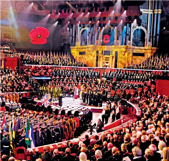  ??  ?? The Royal British Legion’s Festival of Remembranc­e is broadcast from the Royal Albert Hall last night in front of the Queen, above, the Duchess of Cambridge, right, and the Duke and Duchess of Sussex, below, as well as senior members of all three military services