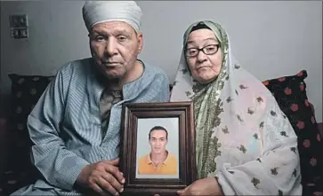  ?? Jonathan Rashad For The Times ?? “WE ARE TIRED, as we are old, and we have suffered over the past five years. We’re physically and mentally exhausted,” says Abdel Shakour Abou Zeid, with wife Reda Mahrous Ali, about what is happening to their son.