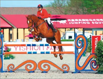  ?? PROVIDED TO CHINA DAILY ?? Liang Ruiji from Guangdong province competes in the Yishion Camelot Grand Prix Jumping Equuleus in Beijing last weekend. Liang finished second in the 1.5-meter class.