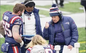  ?? Elise Amendola / Associated Press ?? This was the first losing season for Bill Belichick, right, with New England since his inaugural one in 2000. It ended a streak of 11 AFC East crowns.