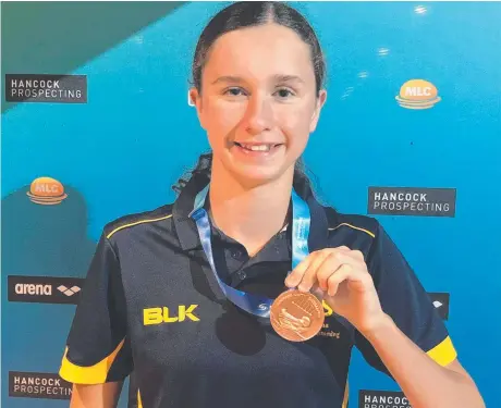  ?? Photo: Contribute­d ?? ON THE MONEY: Sienna Deurloo displays her bronze medal for the 15 years 1500m at the Australian Age Championsh­ips on the Gold Coast.