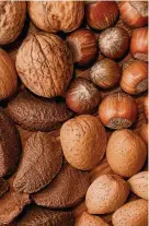  ??  ?? > Being nuts about nuts can help reduce the risk of heart disease