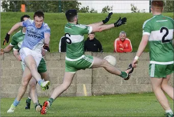  ??  ?? John Kermode fires home a first-half goal for Newtown Blues.