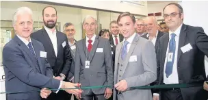  ??  ?? Mike Blackburn (left) cuts the ribbon at the new laboratory with Daniel Royston and Mike Blackburn, OBE, chairman of Greater Manchester LEP