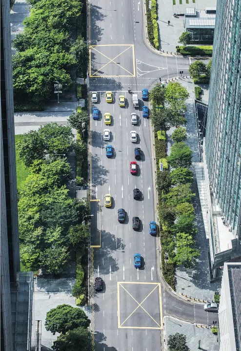  ?? NICKY LOH / BLOOMBERG ?? Singapore provides a glimpse into the future of big city traffic, Diane Francis writes. Among other things, it is banning the purchase of any news cars in February and is introducin­g the world’s first driverless taxi service.