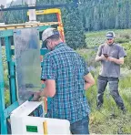  ?? COURTESY OF THE U.S. DEPARTMENT OF ENERGY ?? Heath Powers, left, helps set up radiometer­s for a SAIL in Gothic, Colo., along with site technician Wessley King.