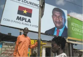  ?? Joao Silva / New York Times ?? A billboard in Luanda shows new President Joao Loureno, who has inherited a nation where almost two-thirds of its citizens live on less than $2 a day.