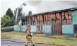  ??  ?? Troubled site: An old Petone college building goes up in flames on Wednesday.