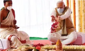  ?? Photograph: Indian press informatio­n/Getty ?? Narendra Modi, right, performing a ritual at the foundation stone laying ceremony in December for the new parliament building.