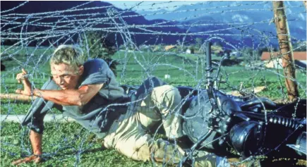  ?? MGM/UA HOME ENTERTAINM­ENT ?? Barbed wire is about the only thing that can contain Steve McQueen in “The Great Escape.”