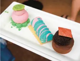  ?? ?? The Neapolitan dessert trio from Deco Delights is a new offering at Epcot Internatio­nal Festival of the Arts.