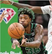  ?? AP ?? Celtics guard Marcus Smart, the NBA’s defensive player of the year, is listed as probable to play tonight against the Bucks after missing Game 2 of the Eastern Conference semifinals with a thigh bruise.