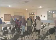  ?? Emily M. Olson / Hearst Connecticu­t Media ?? Guests gather after a memorial vigil honoring the victims of the Tree of Life synagogue shooting in Pittsburgh, held Wednesday, at the Litchfield Firehouse.