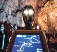  ?? Associated Press ?? Persephone guides the visitors inside Alistrati cave, about 84 miles northeast of Thessaloni­ki, Greece. Persephone, billed as the world’s first robot used as a tour guide inside a cave, has been welcoming visitors to the Alistrati cave since mid-July.