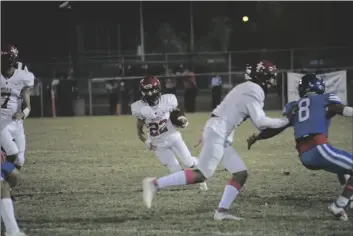  ?? MARIO RENTERIA
PHOTO ?? Imperial High School’s Francisco Lopez runs through a gap against Central Union High School in an Imperial Valley League game Friday in El Centro.