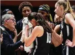  ?? Wade Payne / Associated Press ?? UConn coach Geno Auriemma, left, talks to his players during a timeout against Tennessee on Thursday.