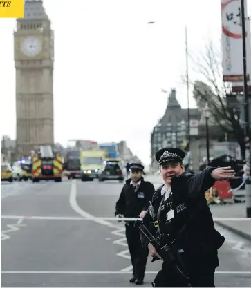  ?? MATT DUNHAM / THE ASSOCIATED PRESS ?? Police secure an area close to the Houses of Parliament in London Wednesday after an attacker killed at least four.