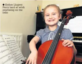  ??  ?? ● Esther Llugwy Parry hard at work practising on the cello