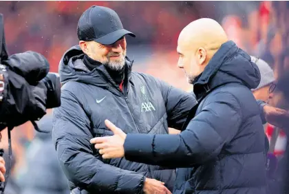  ?? Photo / Getty Images ?? Pep Guardiola (right) says Jurgen Klopp “made me a better manager”.