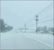  ?? CHRIS WORKMAN SPECIAL TO ENTERPRISE-LEADER ?? This section of Highway 62B in Prairie Grove just past Flash Market was covered with snow Monday morning. Prairie Grove police had not reported any accidents, as of noon Monday.