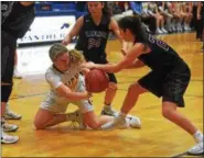  ?? AUSTIN HERTZOG - DIGITAL FIRST MEDIA ?? Pope John Paul II’s Grace Cobaugh and Radnor’s Julia Rigolizzo battle for a loose ball during their District 1-5A playoff game Tuesday.