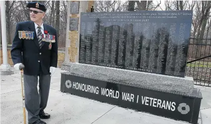  ?? DAN JANISSE/THE Windsor Star ?? Veteran Larry Costello stands next to the refurbishe­d granite memorial at Memorial Park Tuesday. The Windsor Historical Society
and the city teamed up to move the landmark which lists the names of 837 from the area who died in the First World War.