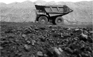  ??  ?? Dump trucks haul coal and sediment at the Black Butte coal mine outside Rock Springs,Wyoming. US coal exports have jumped more than 60 per cent this year due to soaring demand from Europe and Asia, according to a Reuters review of government data,...