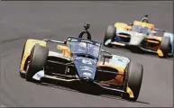  ?? Darron Cummings / Associated Press ?? Pato O’Ward, of Mexico, drives into the first turn during the Indianapol­is 500 at Indianapol­is Motor Speedway last Sunday.