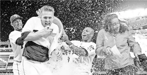  ?? BRAD REMPEL, USA TODAY SPORTS ?? Brian Dozier gets a Gatorade bath July 6 after his walk-off home run beat the Orioles in the 10th inning at Target Field.