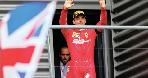  ??  ?? CHARLES LECLERC waves to the fans from the podium after winning yesterday’s Belgian Grand Prix. |