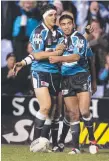  ??  ?? Vince Mellars (left) after scoring a try for Cronulla in 2005.