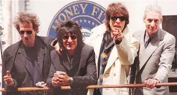  ?? TIMOTHY CLARE/GETTY IMAGES/FILES ?? Keith Richards, left, and Ronnie Wood (seen with Mick Jagger and Charlie Watts) have shared a long friendship, with Richards describing his bandmate as an “over-the-top man.”